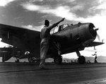 Aboard San Jacinto, Lieutenant Commander Albert B. Cahn gave signal to a VT-51 TBM-1C Avenger to take off for an exercise, 16 May 1944