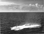 US Navy pilot Lt (jg) C. Clifton Francom unsuccessfully testing TBM Avenger torpedo bomber with experimental wing mounted radome aboard Ticonderoga, 4 Jul 1944, photo 4 of 5