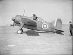 A British pilot entering the cockpit of a Buffalo fighter, date unknown