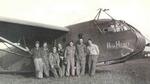 Glider pilot Charlie Rex (on right) and the Glider Engineering section of the US 315th Troop Carrier Group posing in front of CG-4A glider 