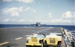 F4U-4 Corsair fighter of US Navy squadron VF-713 taking off from USS Antietam, off Korea, Sep 1951-May 1952; note jeeps in foreground