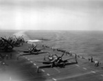F4U-4 Corsair, AD-2/4Q Skyraider, and F9F-2 Panther aircraft aboard USS Boxer, off Korea, 19 May 1951; note HO3S-1 helicopter in flight