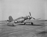 F4U-1 Corsair fighter at Langley Research Center at Hampton, Virginia, United States, 31 Jul 1943. Note the P-47 Thunderbolt on the taxi way behind the Corsair