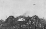 F4U Corsair aircraft dropping napalm on a Japanese position on the Umurbrogol Mountain, Peleliu, Palau Islands, 1944