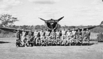 Aerial gunners of 3rd Bomb Group, US 8th Bomb Squadron (Light) pose with an A-24 Banshee aircraft at Charters Towers, Australia, Jan-Mar 1942
