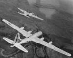 B-17 Flying Fortress bomber and B-29 Superfortress bomber in flight together during a test conducted by Boeing, circa late 1944, photo 1 of 3