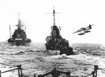 He 115 aircraft performing a low fly-by Prinz Eugen and other German warships, date and location unknown