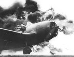 F6F-5 Hellcat fighter of US Navy pilot Ensign John G. Fraifogl caught on fire upon landing during USS Ticonderoga