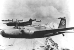 Ki-21-II bombers in flight over a mountain range, circa 1940s