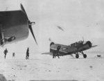US Navy OS2U Kingfisher aircraft immediately after landing in snow after a scouting mission in the North Atlantic, 2 Feb 1943; note squadron canine mascot 
