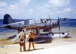 OS2U Kingfisher at the edge of the seaplane ramp at NAS Pensacola, Florida, United States, early 1941. Note Consolidated P2Y flying boat laying off shore, photo 2 of 2 (color)