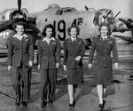 WASP pilots Eloise Huffines Bailey, Millie Davidson Dalrymple, Elizabeth McKethan Magid, and Clara Jo Marsh Stember in front of their B-24 aircraft, Aug 1943-Jan 1947