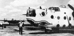 Maj John A Hansler in front of B-24H Liberator aircraft 