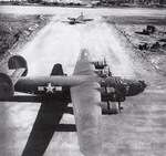 US Navy PB4Y-1 Liberator bomber on an airfield at Kwajalein, Marshall Islands, Jan-Feb 1944; note Corsair fighter in background