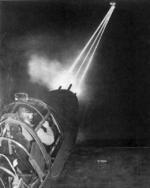 Nose guns of a P-38 Lightning aircraft lighting up the night sky as an armorer test-fired weapons after routine maintenance, date unknown