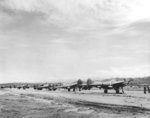 Line of P-38 Lightning escort fighters at Jackson Field, Port Moresby, New Guinea, 1942-1943