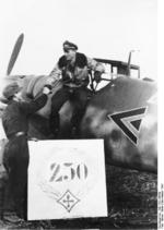 German pilot Major Günther Rall being congratulated as he exited his Bf 109 fighter after scoring his 250th kill, Nov 1943