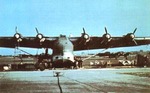 Me 323 Gigant heavy transport at rest, circa 1940s; aircraft in background appeared to be He 111 medium bombers