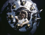 Female worker of North American Aviation working on the cowling of an engine for a B-25 Mitchell bomber, Inglewood, California, United States, Oct 1942