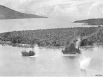 US B-25D bomber being destroyed by the blast of a bomb of a preceding friendly bomber, Hansa Bay, Australian New Guinea, 28 Aug 1943, photo 1 of 3