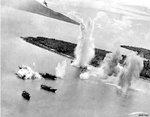 US B-25D bomber being destroyed by the blast of a bomb of a preceding friendly bomber, Hansa Bay, Australian New Guinea, 28 Aug 1943, photo 3 of 3