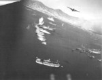 B-25 bomber attacking shipping in Victoria Harbour, Hong Kong, possibly during the 16 Oct 1944 raid by US 14th Air Force