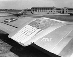 B-18 Bolo bomber port wing with low-drag experimental panel, Langley Field, Virginia, United States, 1 Jan 1941; note P-43 Lancer fighter in background