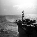 SOC Seagull aircraft being recovered by cruiser Philadelphia, off North Africa, Nov 1942, photo 1 of 4
