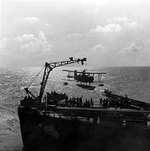 SOC Seagull aircraft being recovered by cruiser Philadelphia, off North Africa, Nov 1942, photo 3 of 4