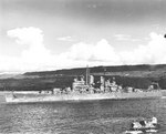 Cruiser USS Denver entering Havannah Harbor, Efate, New Hebrides, 22 Apr 1943 as seen from cruiser USS Columbia; note SOC floatplane in foreground