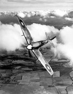 Spitfire fighter banking in the clouds, date unknown