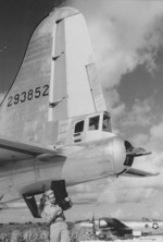 Unloading photographs from a B-29 Superfortress reconnaissance aircraft, Mariana Islands, 1945