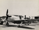 New Jersey National Guard 108th Fighter Group Captain Peterson and Staff Sergeant Iglio making check of P-47 aircraft before takeoff, circa 1939-1945
