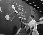George McCraw, worker at Vega Aircraft Corporation, applying nose art on a PV-1 Ventura aircraft, Burbank, California, United States, circa May 1942