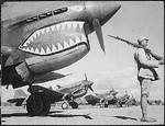 Chinese soldier guarding P-40 Warhawk fighters of the AVG 