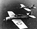 Two Wildcats in flight near Naval Air Station, Kaneohe, Oahu, Hawaii, 10 Apr 1942