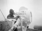 Ice forming on a 20-inch signal projector on the cruiser HMS Sheffield while escorting a convoy in the Norwegian Sea or Barents Sea, Dec 1941