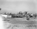 Unloading equipment on a beach near Salerno, Italy, Sep 1943