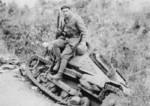 Greek soldier posing with a wrecked Italian L3/33 tankette during the Battle of Elaia-Kalamas, northern Greece, early Nov 1940