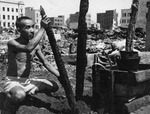 A Japanese civilian in the ruins of Yokohama, Japan, 1945