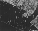 Bombs falling on the port of Osaka, Japan, mid-1945