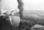 Japanese oil tanker, destroyer, and harbor facilities burning after being attacked by Allied aircraft during Operation Cockpit, Sabang, Sumatra, 19 Apr 1944