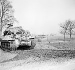 British Achilles tank destroyer on the east bank of the Rhine River, 26 Mar 1945; note abandoned gliders in background