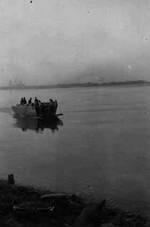 1st Squad of A Company of US 150th Combat Engineer Battalion crossing the Rhine River in Germany by an US Navy landing craft, 23 Mar 1945