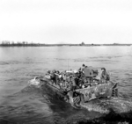 Men of the British 5th Dorsetshire Regiment crossing the Rhine River into Germany in a Buffalo tracked landing vehicle, 28 Mar 1945