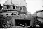 Destroyed house in France, May-Jun 1940, photo 1 of 2; note bunker entrance beneath the house