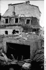 Destroyed house in France, May-Jun 1940, photo 2 of 2; note bunker entrance beneath the house
