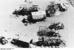Aerial view of burned out trucks at Calais, France, 1 Jun 1940