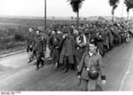 French and colonial prisoners of war on a road in northern France, 1940