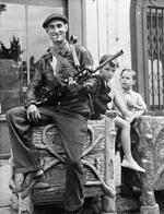 Member of the French Forces of the Interior (FFI) posing with his Bren gun, Châteaudun, Eure-et-Loir, France, Aug 1944